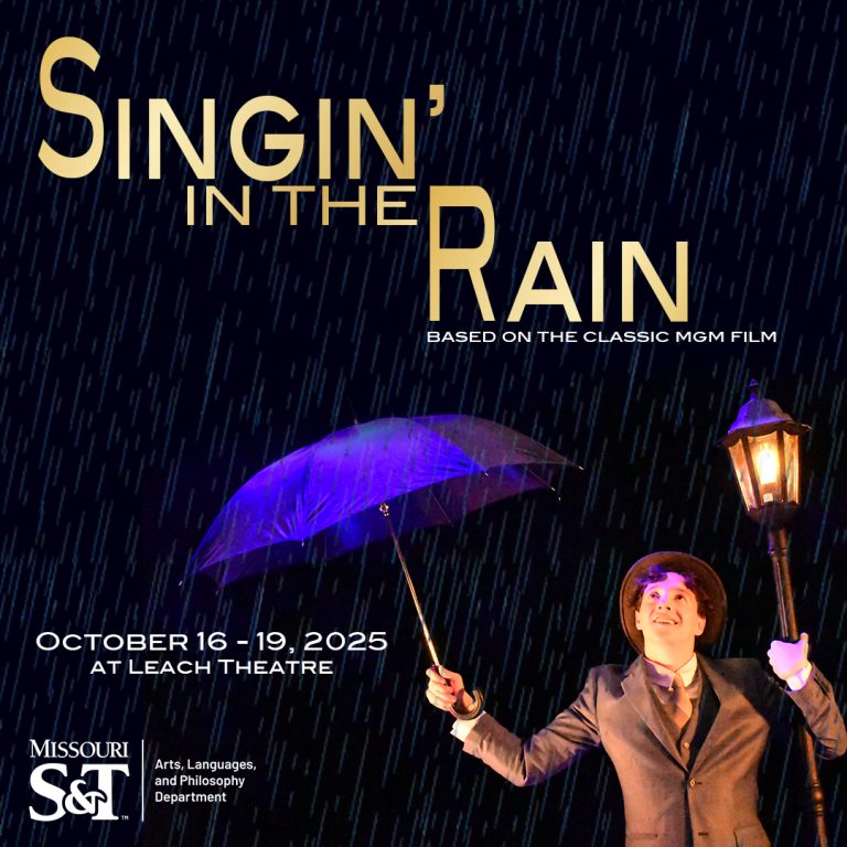 Student holding a blue umbrella