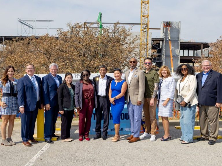 Legislators and UMKC Executive Team with the Beam