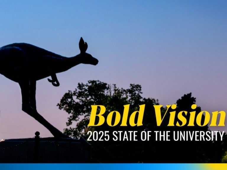 UMKC Kangaroo statue in front of a purple sky and the State of the University title in the corner