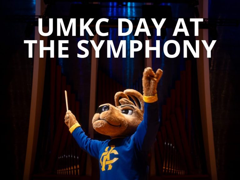 KC Roo conducting the symphony with UMKC Day at the Symphony text above