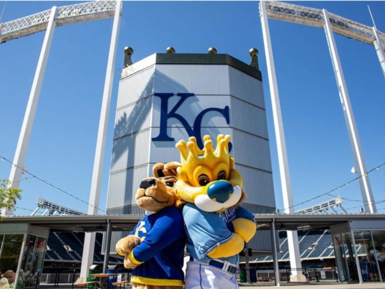 UMKC and Royals mascots pose in front of Kauffman Stadium
